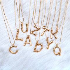 Colgante Inicial Bronce